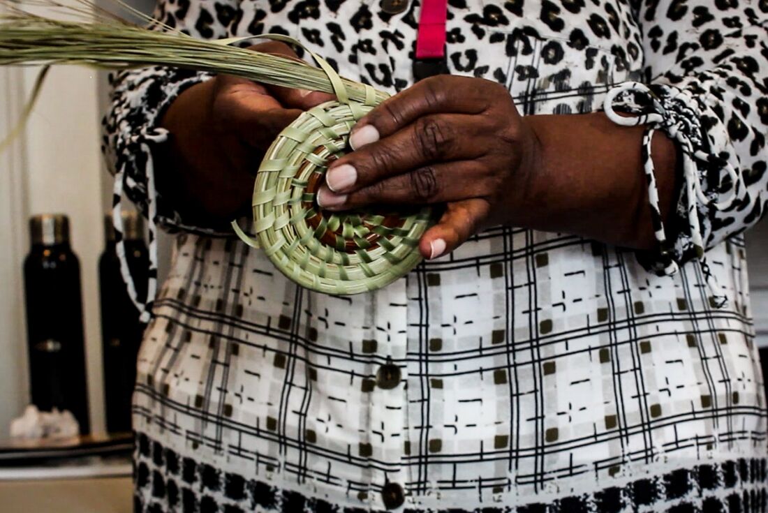 Learning how to weave a sweetgrass basket, Charleston, South Carolina, USA